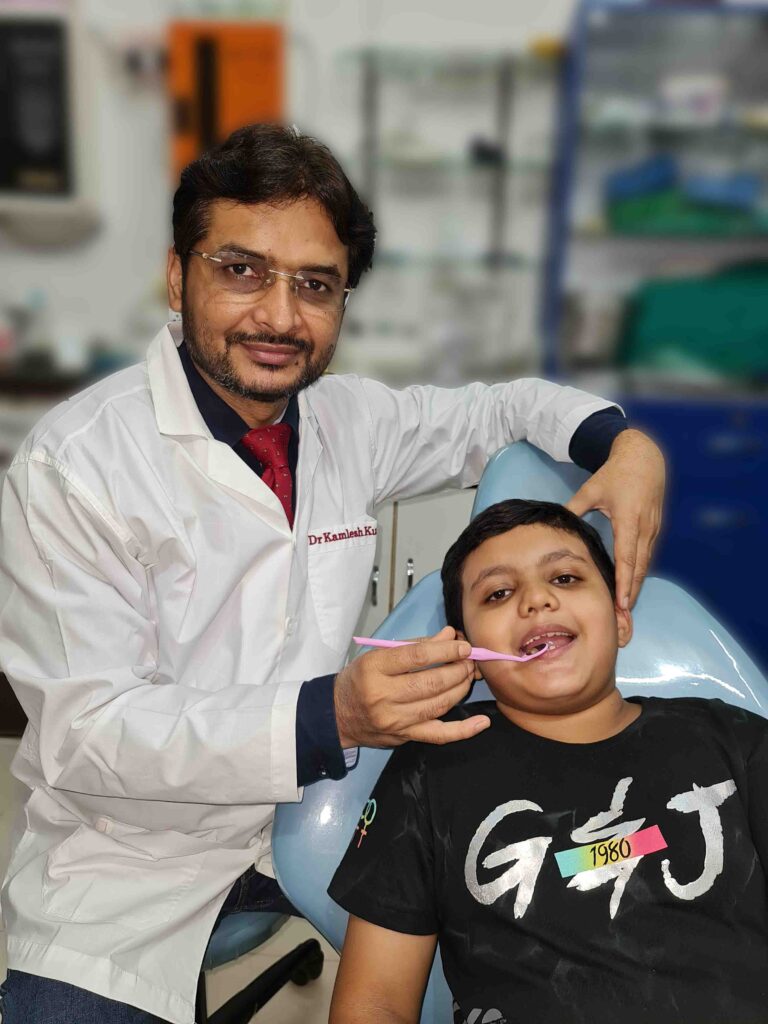 dr kamlesh kumar treating child at ramanuj dental clinic